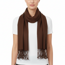 A model wearing a solid brown scarf with fringed ends, styled over a white t-shirt against a plain white background.