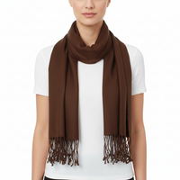 A model wearing a solid brown scarf with fringed ends, styled over a white t-shirt against a plain white background.