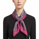 Pink and purple patterned scarf on a white background