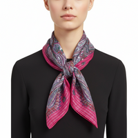 Pink and purple patterned scarf on a white background