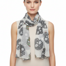 Scarf with skull and peace sign pattern on a white background