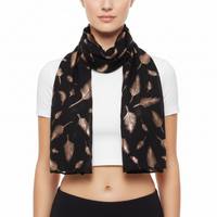 A scarf with rose gold foil feather print, draped and displayed on a plain background.