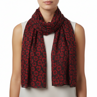Red and black patterned scarf on a white background