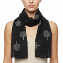A black scarf with white printed tree patterns.