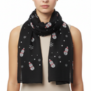 A black scarf with a pattern of snowflakes and snowmen.