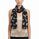 A black scarf with a pattern of silver foil butterflies.