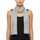 A gray scarf with silver foil bees printed throughout, displayed on a plain background.