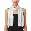A white scarf with a multicolored dot pattern, displayed on a plain background.