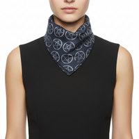 Person wearing a black sleeveless top with a patterned scarf around their neck on a white background