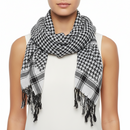 Person wearing a black and white checkered scarf on a white background