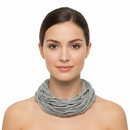 Woman wearing a gray scarf on a white background
