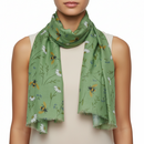 Green scarf with floral and bee pattern on a white background