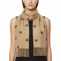 Beige scarf with embroidered bee designs on a white background