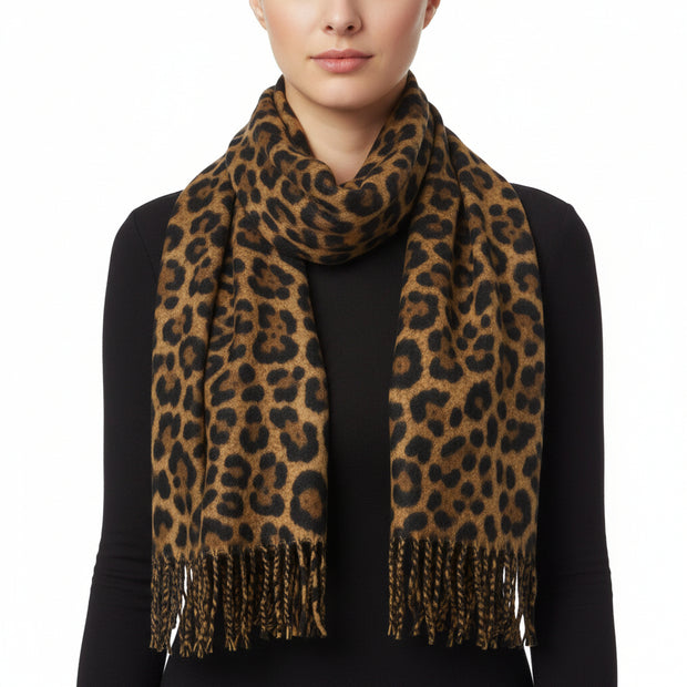 A leopard print scarf with fringes, primarily in brown and black colors.