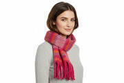 A multicolored striped scarf with tassels, primarily in pink and purple shades.