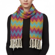 A multicolored geometric patterned winter scarf with rope tassels.