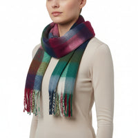 A multicolored checkered scarf with tassels displayed flat.