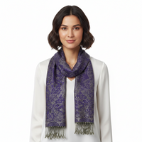 A purple paisley print pashmina scarf with tassels on a white background