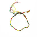 Bracelet with red, yellow, and green braided pattern on a white background