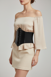 A green elasticated waist lace-up corset belt with velcro fastening.