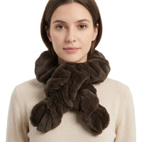 Woman wearing a brown faux fur scarf on a white background