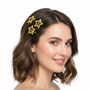 Six small glittery gold star-shaped hair claw clips arranged in two columns of three on a plain white background.