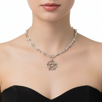 A silver-toned metal necklace displayed on a black jewelry bust. The necklace features a textured chain with barbed wire details and a central pentagram pendant.