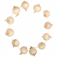 Decorative string of beige paper lanterns on a white background