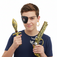 A set of pirate-themed accessories including a gold-colored dagger with black details, a black and gold gun with ornate engraving, an eye patch, and a clip-on yellow earring shaped like a skull.