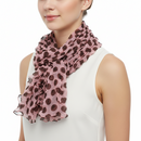 Pink and brown patterned scrunchie on a white background