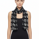 Black scarf with skull and crown pattern on a white background