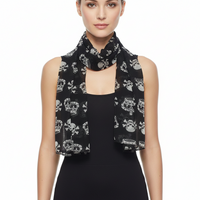 Black scarf with skull and crown pattern on a white background