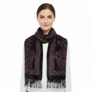 A black rectangular scarf with ornate floral embroidery in pink, red, and gray, finished with a fringed hem, shown against a plain white background.