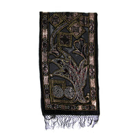A black embroidered scarf with intricate gold, brown, and silver floral and geometric patterns, finished with a fringed hem, shown against a plain white background.