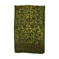 An olive green velvet textile, likely a traditional shawl or scarf, featuring an intricate floral and paisley pattern in brown, gold, and red, with a decorative border at the bottom, shown against a plain white background.