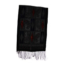 A black woven scarf with geometric and paisley patterns, featuring red accents and fringed edges, shown against a plain white background.
