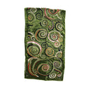 A green velvet textile featuring an intricate pattern of swirling Celtic-style spirals in black, silver, and red, displayed flat against a plain white background.