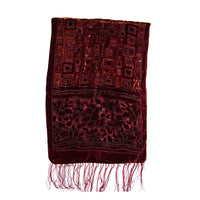 A dark red velvet scarf with intricate geometric and floral embroidery, finished with fringed tassels at the bottom, shown against a plain white background.