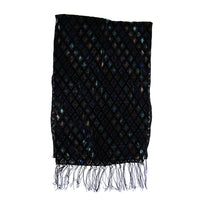 A black woven scarf with a repeating diamond pattern containing blue, green, and purple reflective sequins, finished with fringed edges.