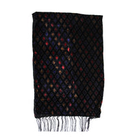 A black woven scarf with a repeating diamond pattern in red, blue, and gold, finished with fringed edges, shown against a plain white background.