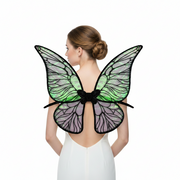 A pair of iridescent green butterfly wings with black and purple details.