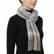 A checkered scarf in shades of gray and blue, knotted at the center with fringed ends.