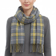 A checkered scarf with gray and yellow colors, fringed at the ends.