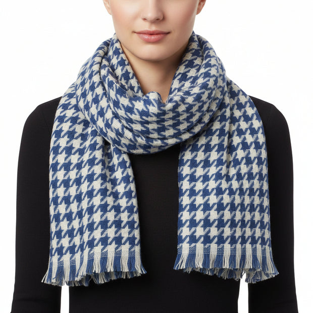 A blue and white checkered scarf with fringed edges.