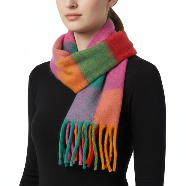 A multicolored checkered scarf with fringes displayed on a white background