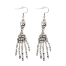 Hanging Skeleton Hands off Skulls Earrings
