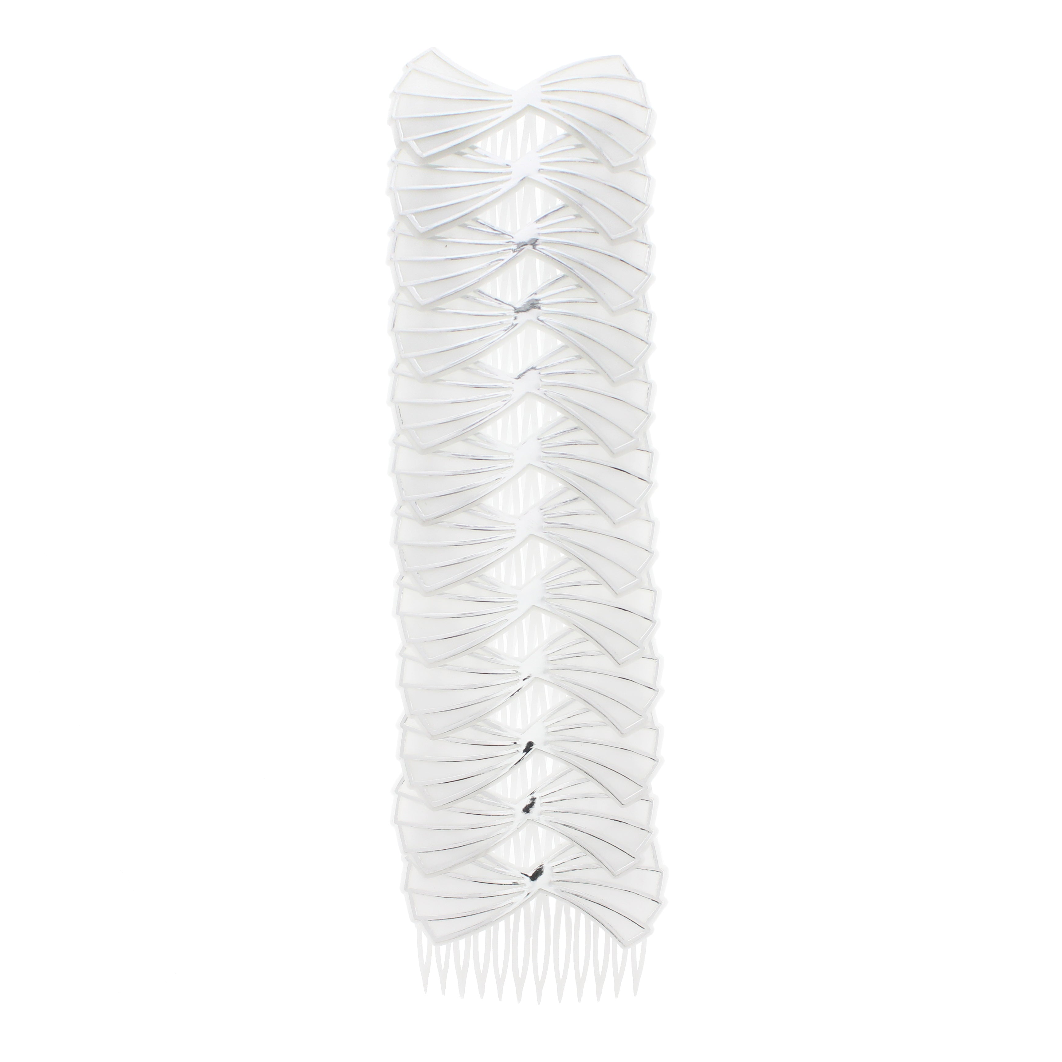 A white comb with large silver bows attached to it