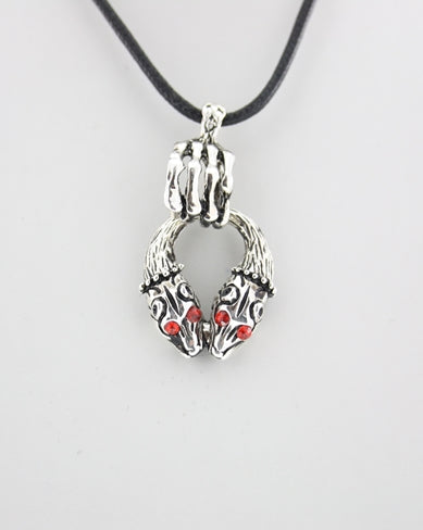 Hand Holding Jackal Heads Thong Necklace